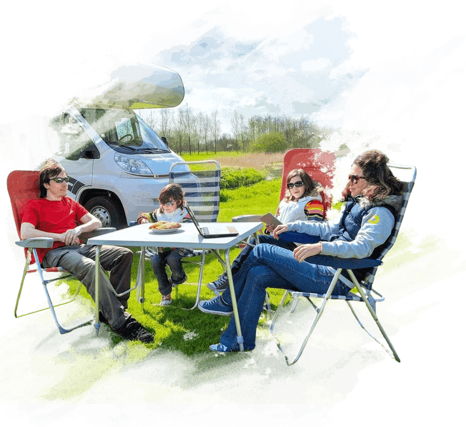 A group of people sitting at an outdoor table.