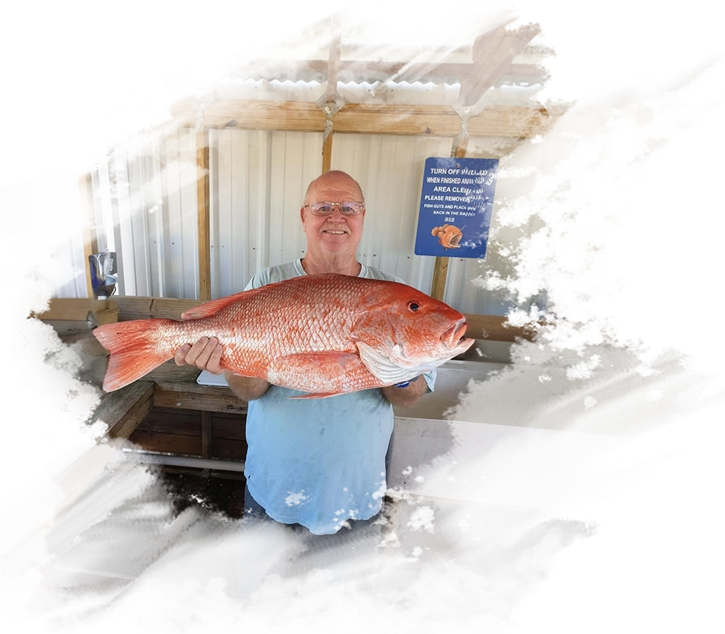 A man holding a large fish in his hands.