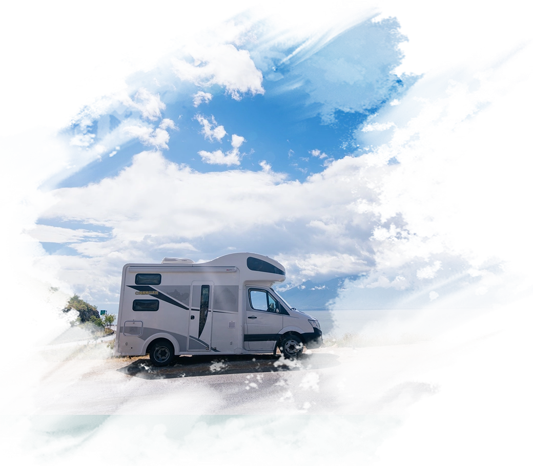 A white camper van parked on the side of a road.